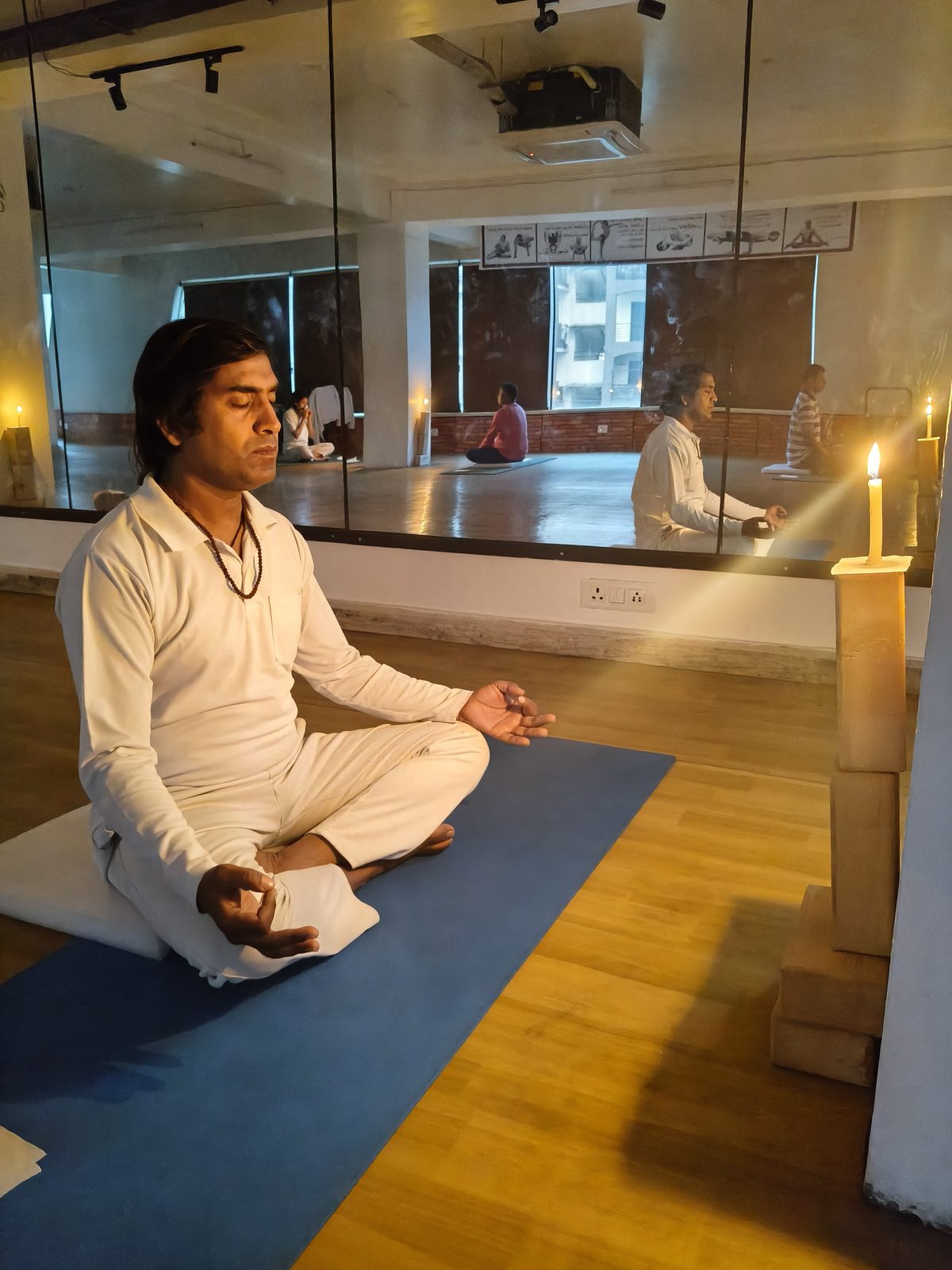 Students practicing guided Iyengar yoga therapy